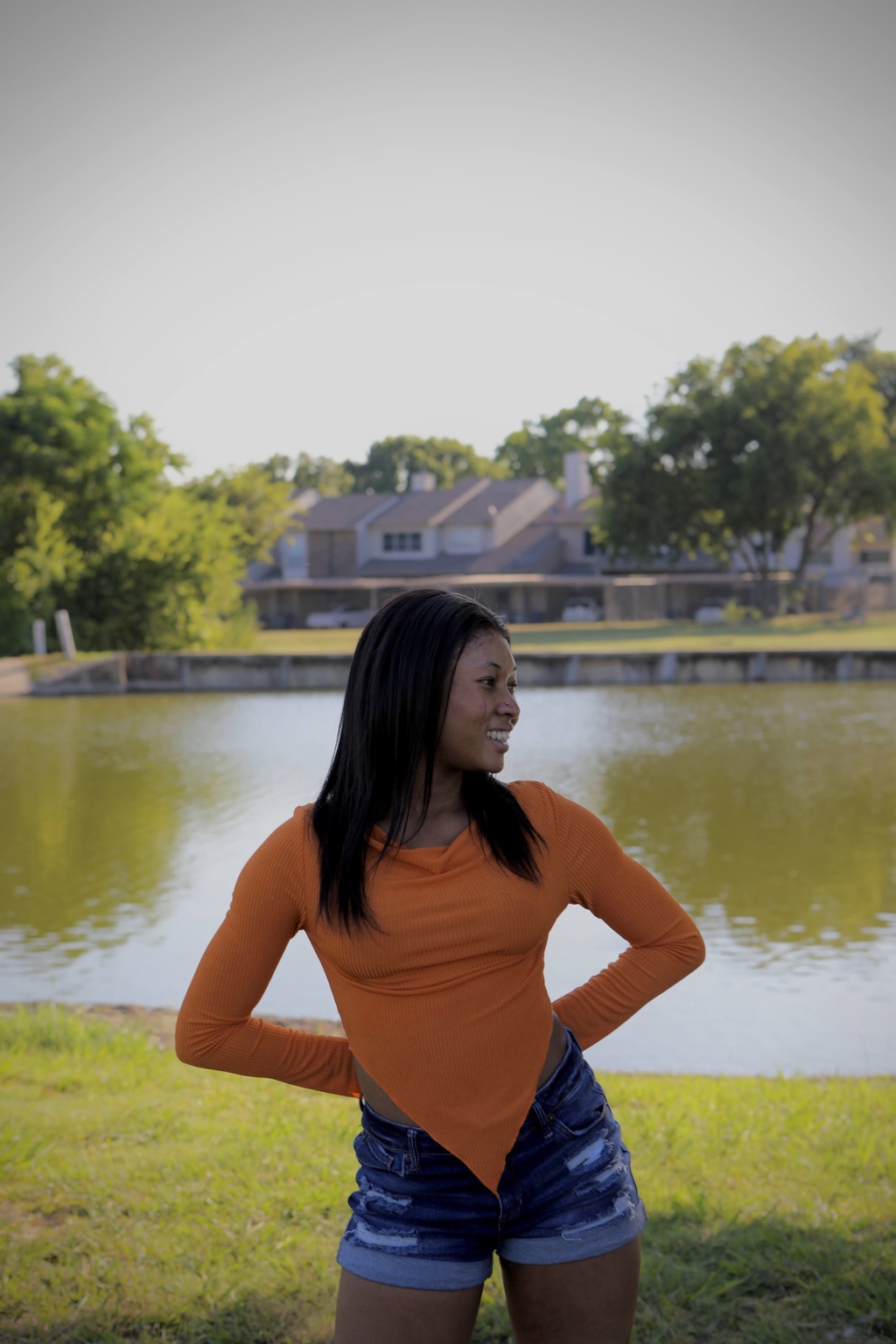 Lakeside portrait with water and greenery in the background